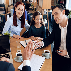 Attorney meeting with a family to discuss digital legal assistant services.